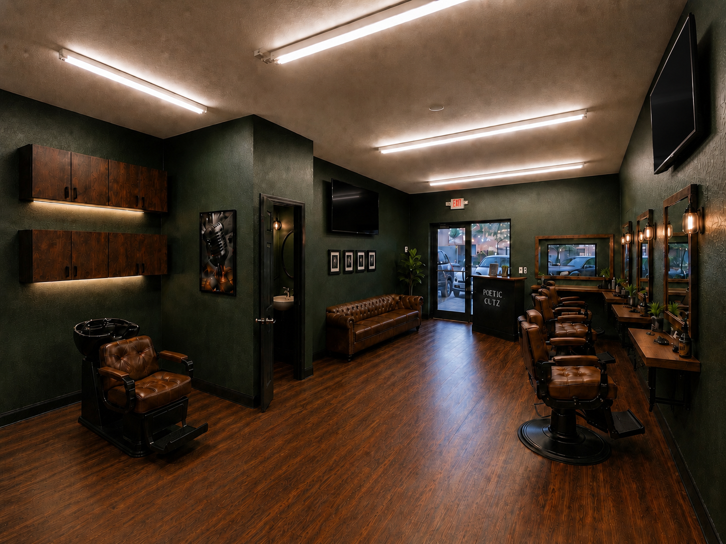 Interior of Poetic Cutz Barber Lounge with olive green walls, leather chairs and warm wood floors